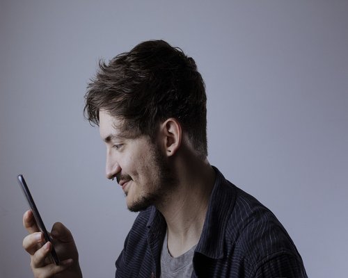 Person relaxing on a modern sofa away from digital screens