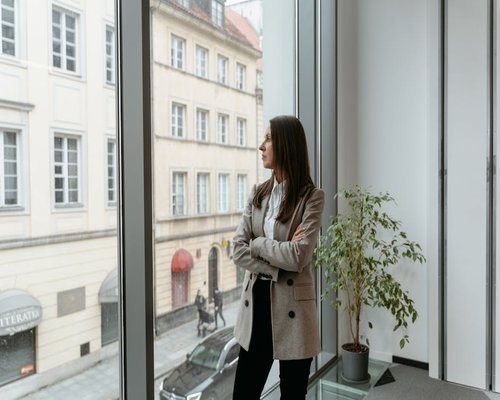 Professional looking out of the window during a work break